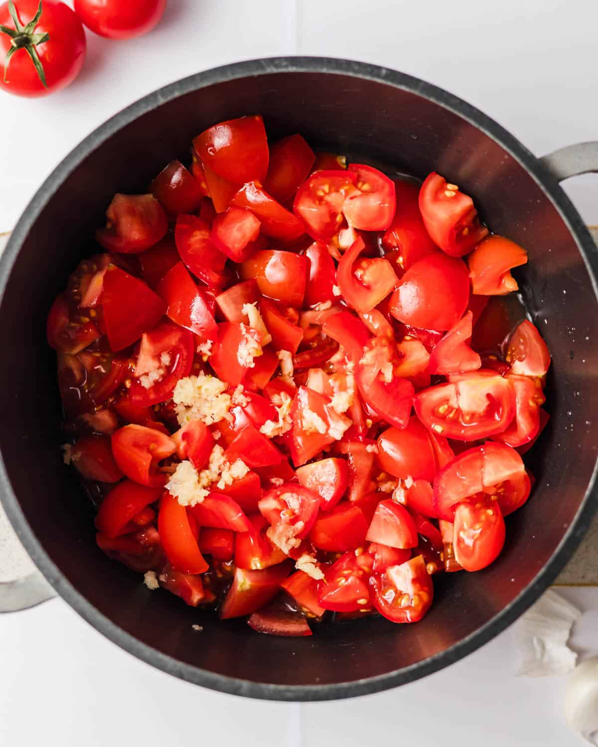 tomatoes in a pot to make tomato jam