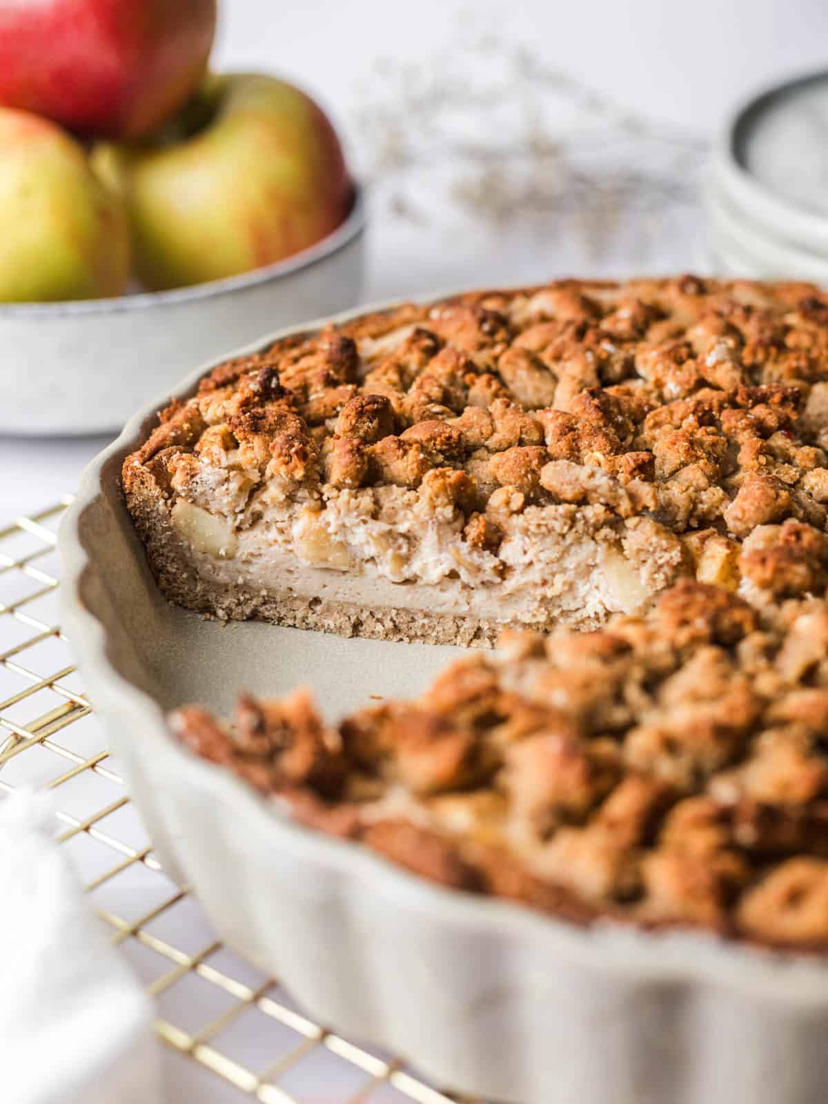sliced vegan apple crumble cheesecake