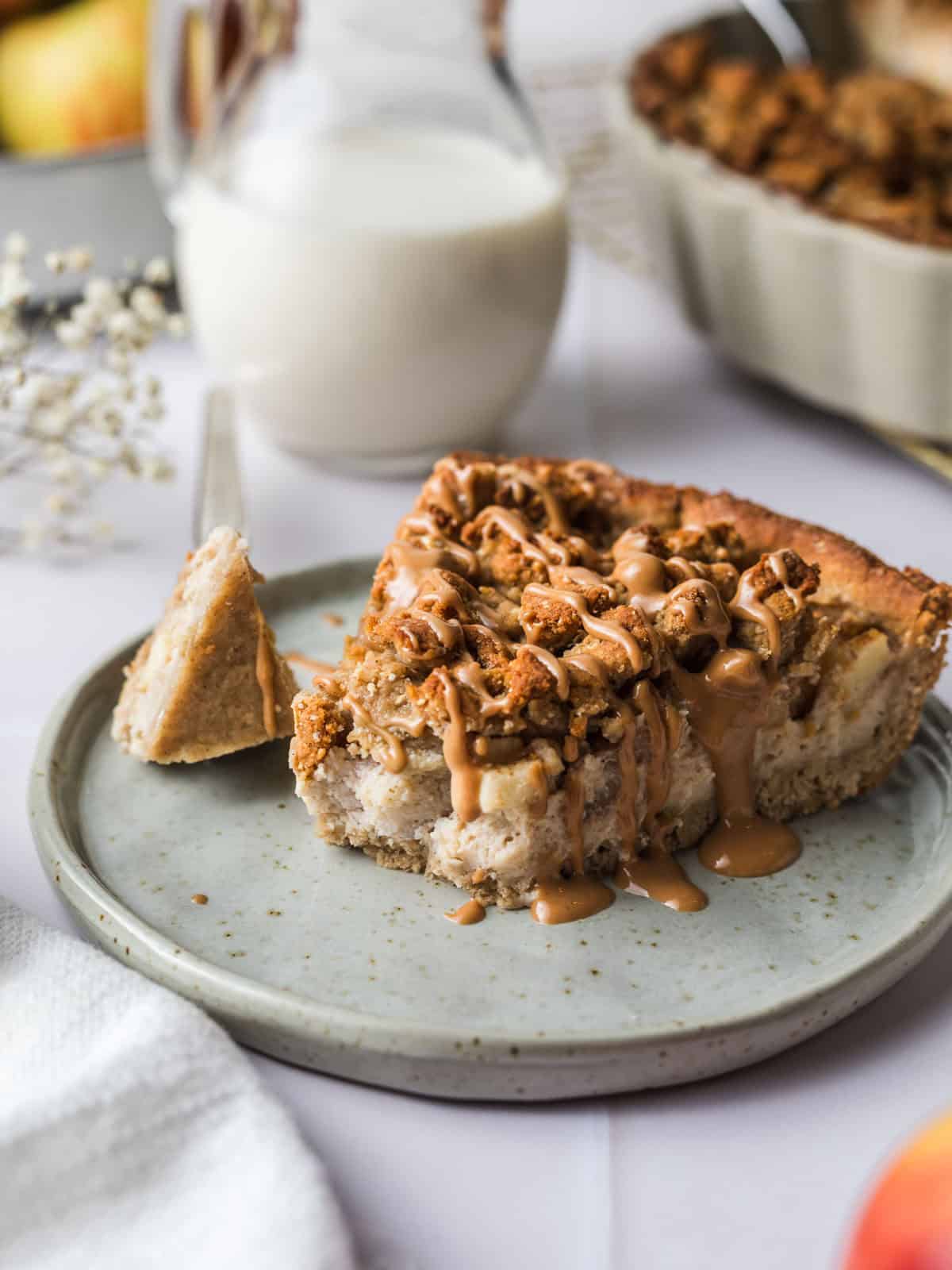 sliced apple crumb cake with caramel sauce