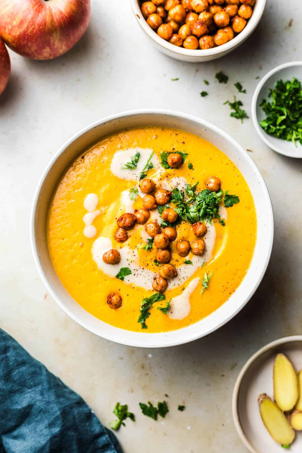 creamy soup with carrot and crunchy chickpea topping