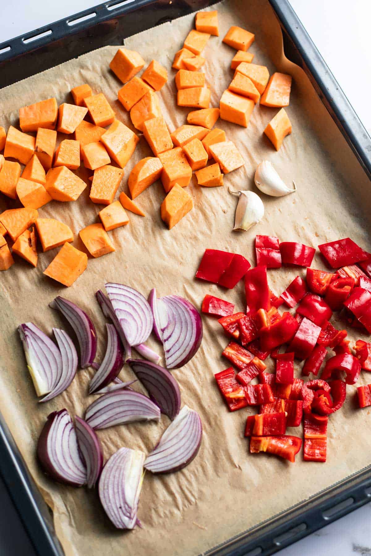 tray bake with sweet potatoes and garlic