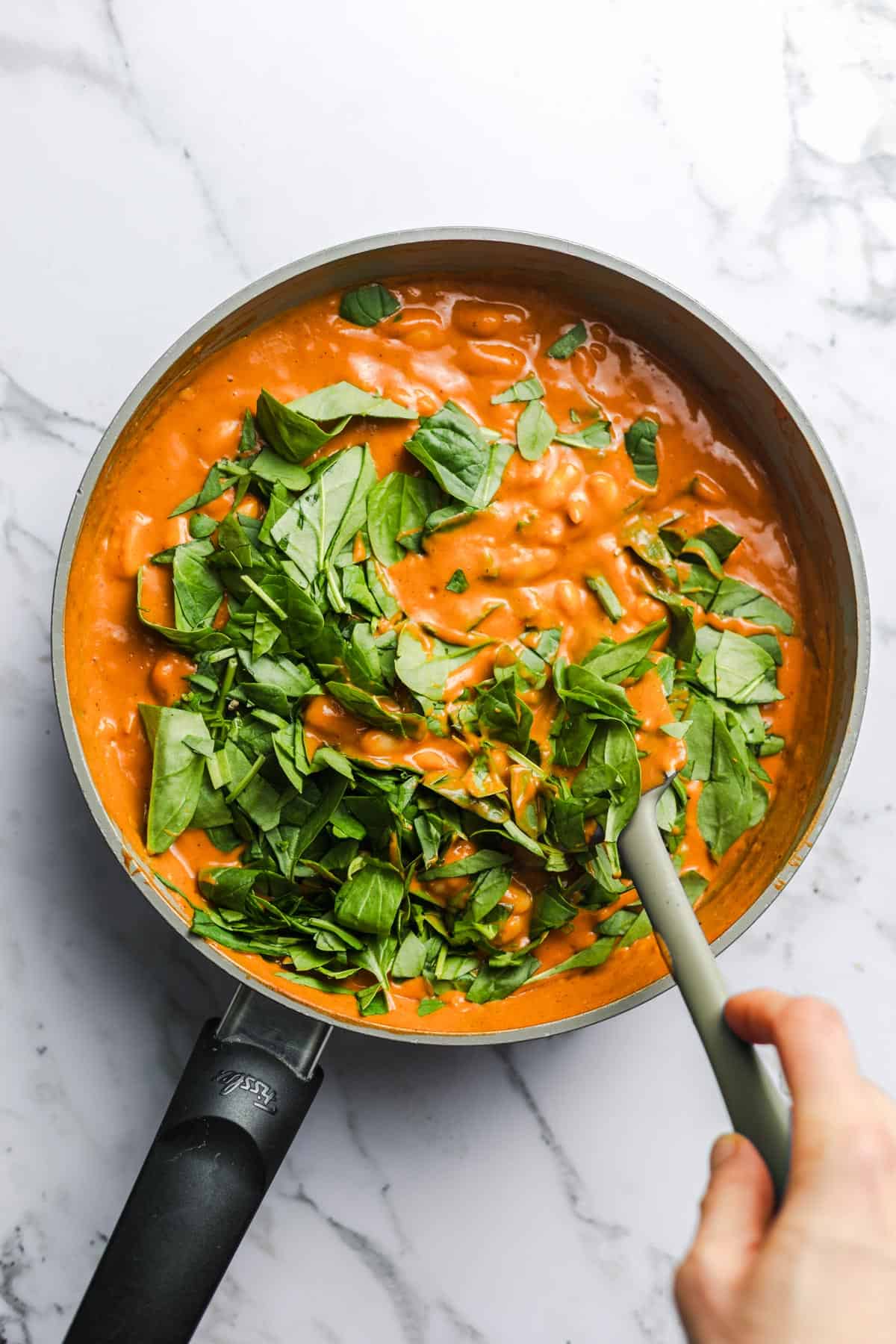 spinach and beans in sacue