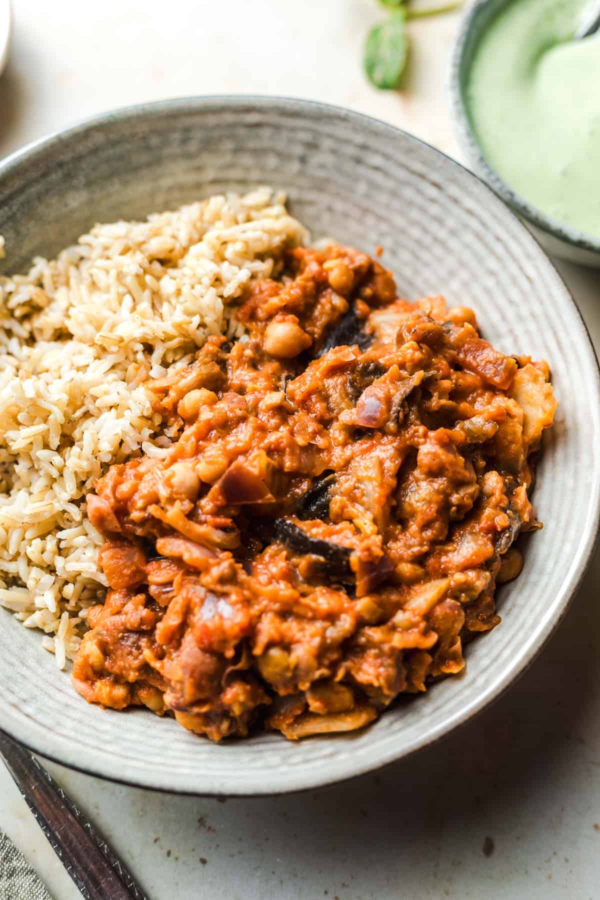 vegan chickpea curry with roasted eggplant on rice