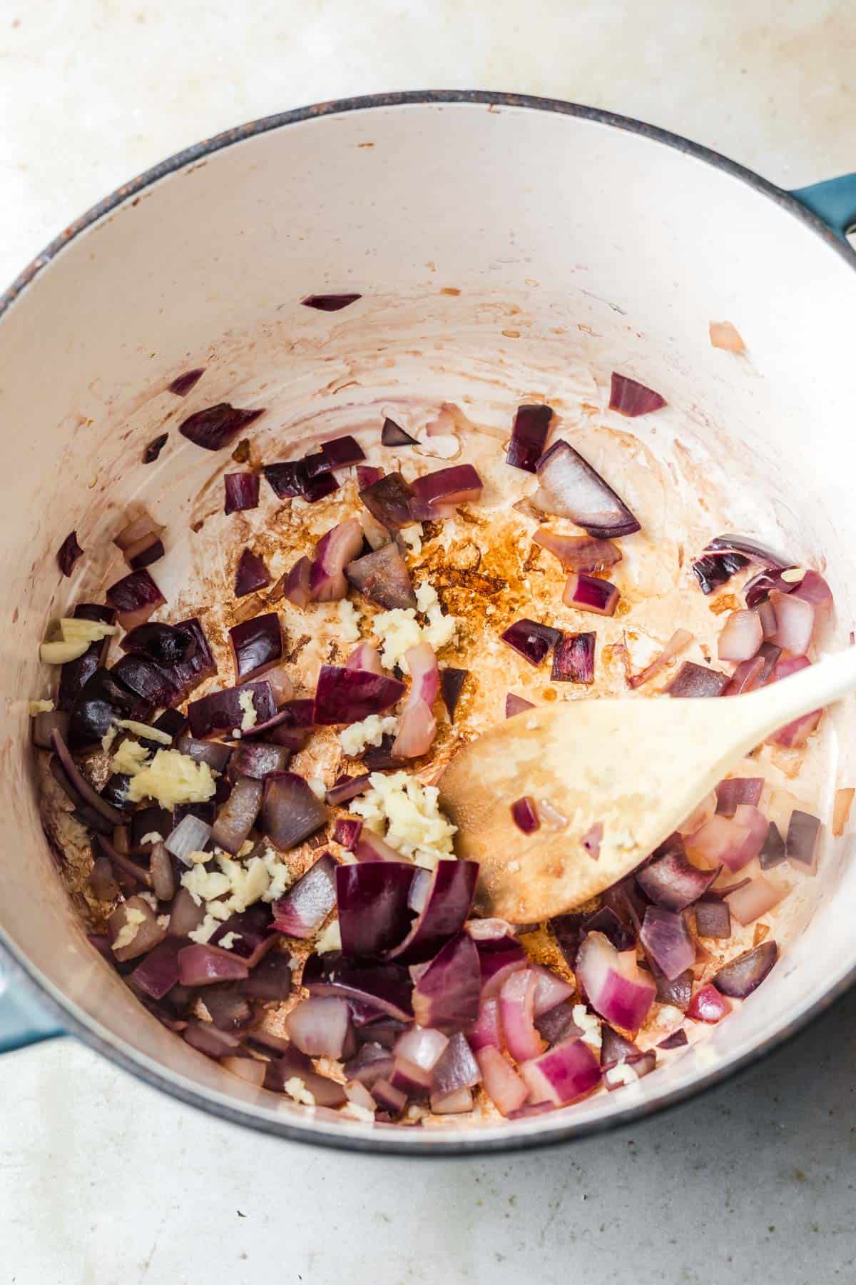 sauteeing red onion and garlic in pot
