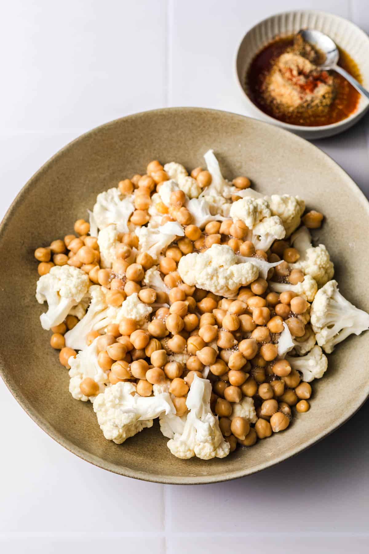 califlower florets and chickpeas in a bowl