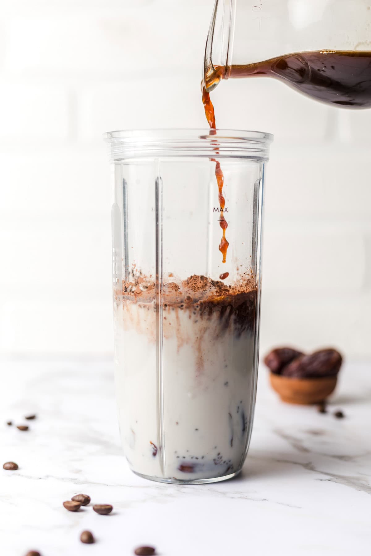 blender with milk, chia seeds, cacao and coffee