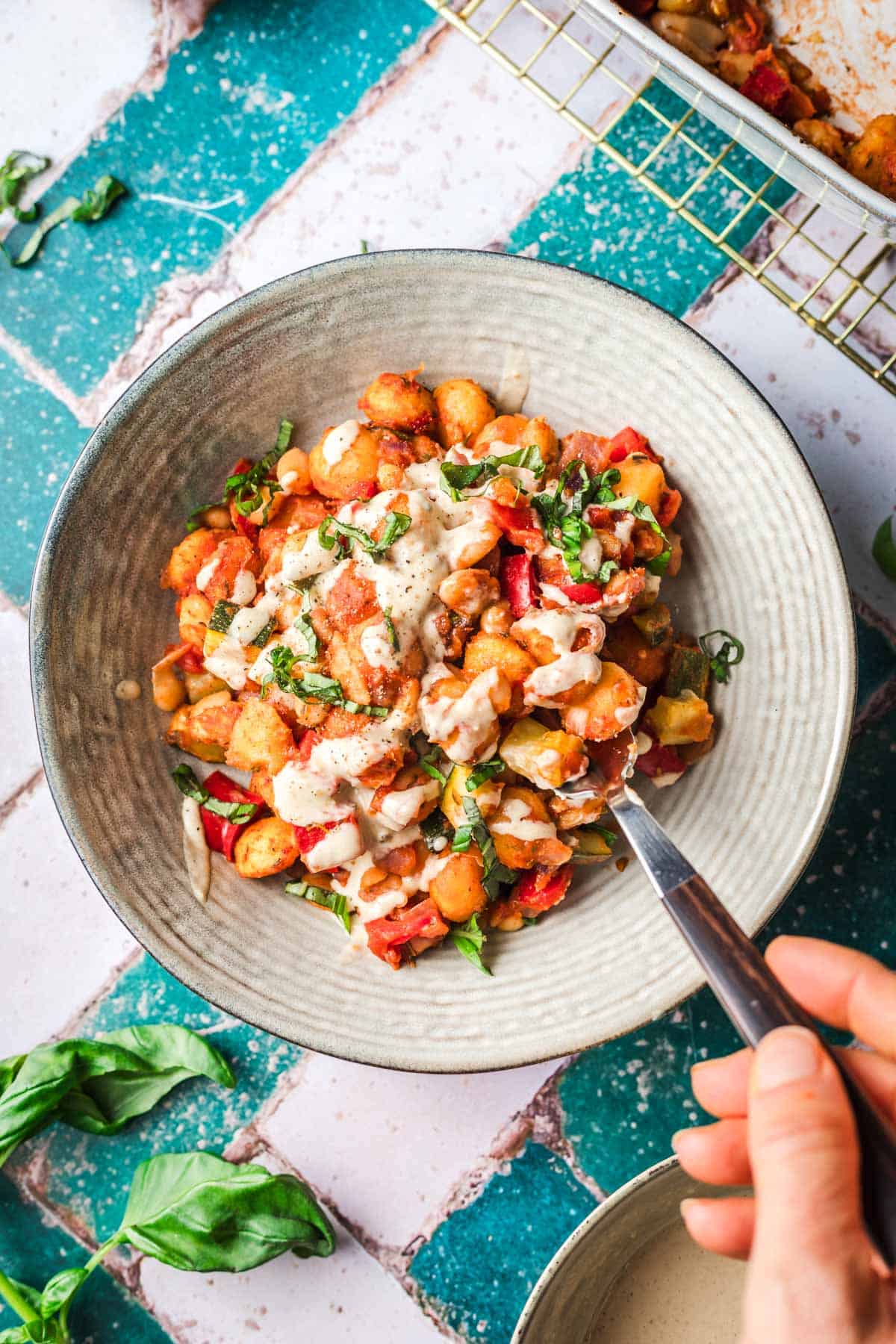 baked gnocchi dish with tomatoes