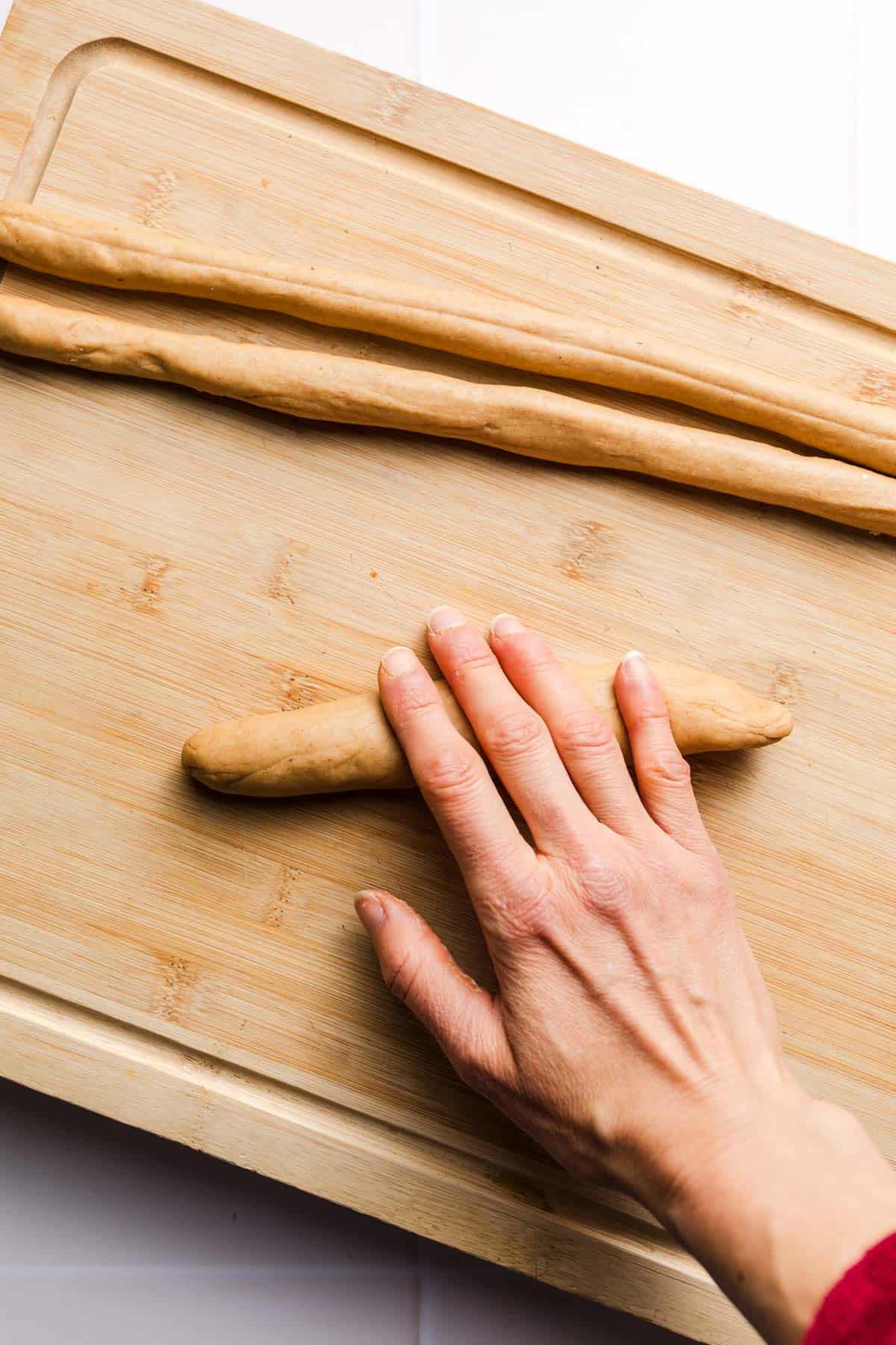 rolling strands of sweet dough