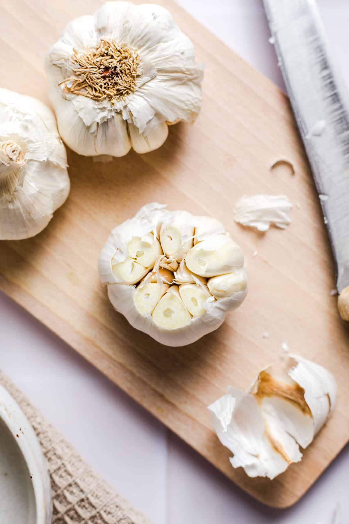 Garlic bulb with the top sliced off to expose the cloves