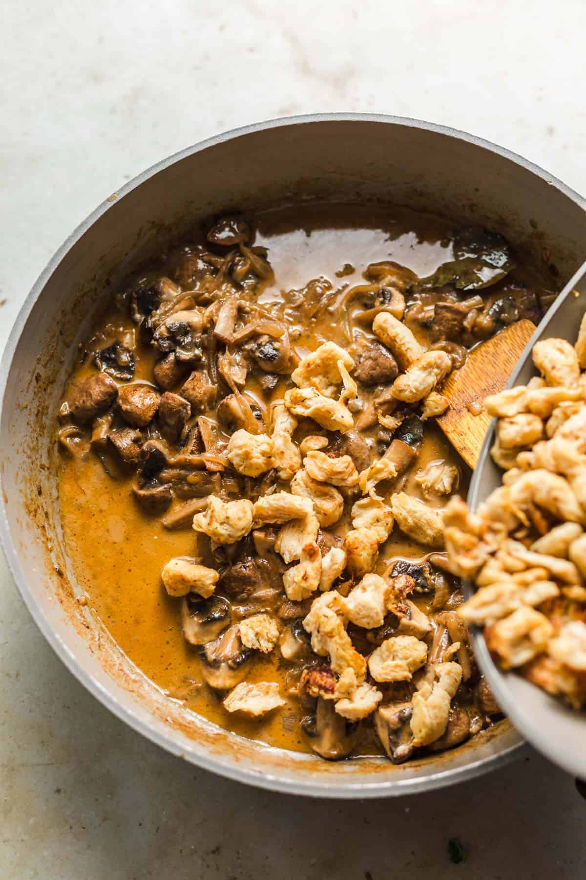cooking vegan beef stroganoff with textured soy protein