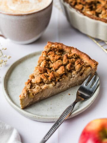 slice of dairy-free and eggless apple cake with crumbles
