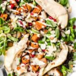 roasted sweet potato on greens with tahini dressing