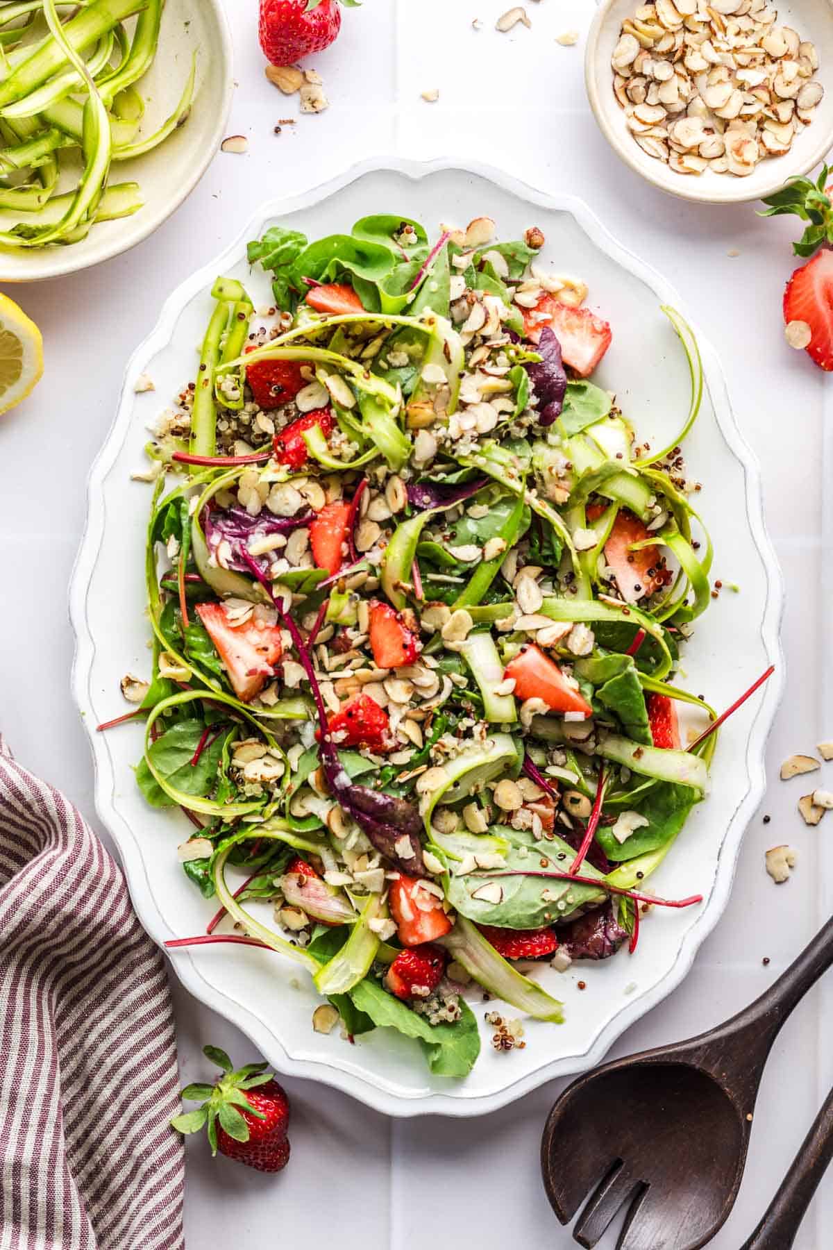 Raw green asparagus salad with strawberries and quinoa