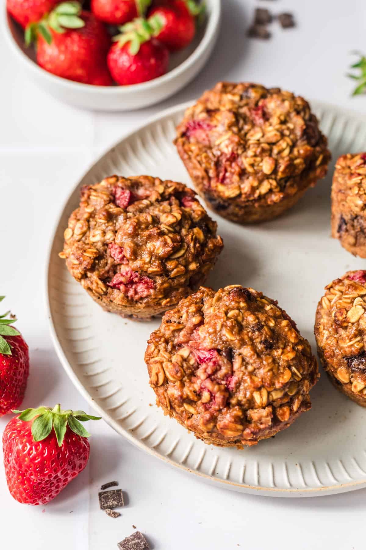 Vegan healthy oatmeal muffins with strawberries, chocolate, and peanut butter