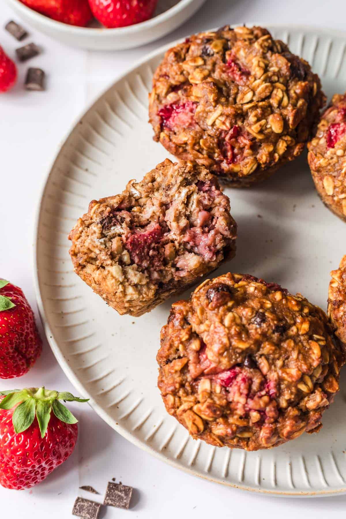Moist healthy oat muffins without sugar with fresh strawberries
