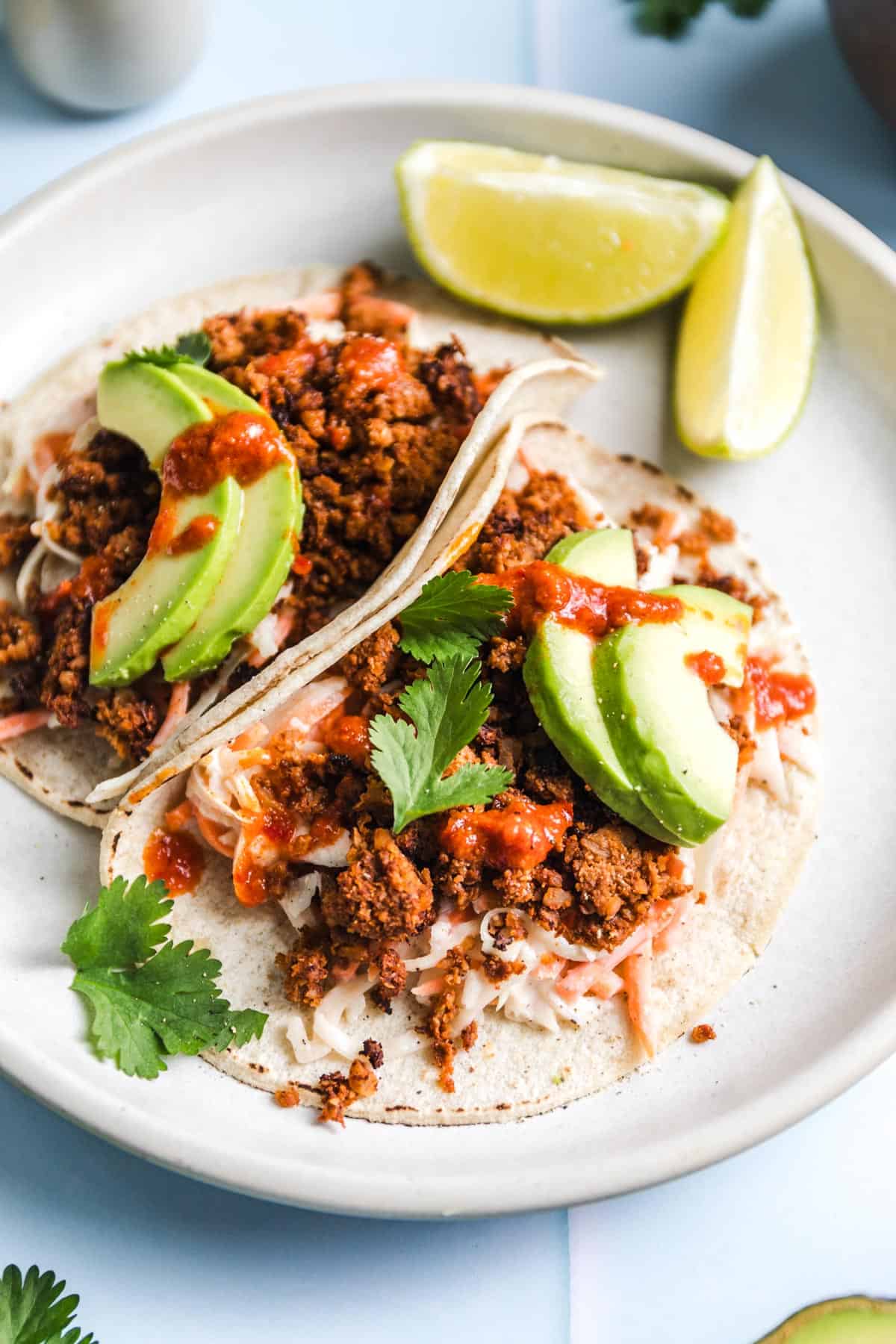 oil-free Vegan tacos with cauliflower meat and coleslaw on a plate
