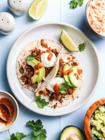 Vegan tacos with smoky cauliflower walnut meat and creamy coleslaw