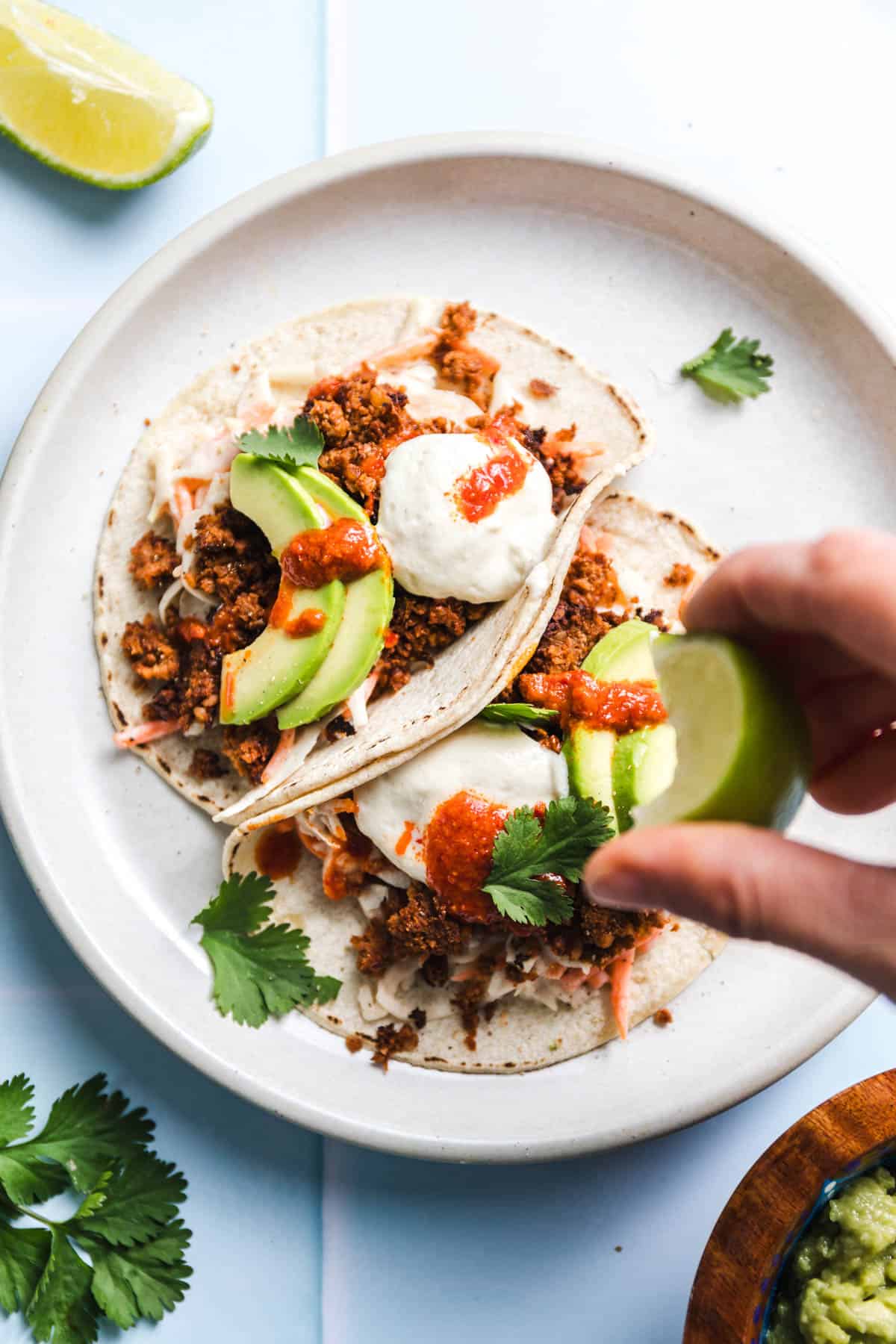 Vegetarian tacos with veggie walnut meat and fresh toppings, close-up