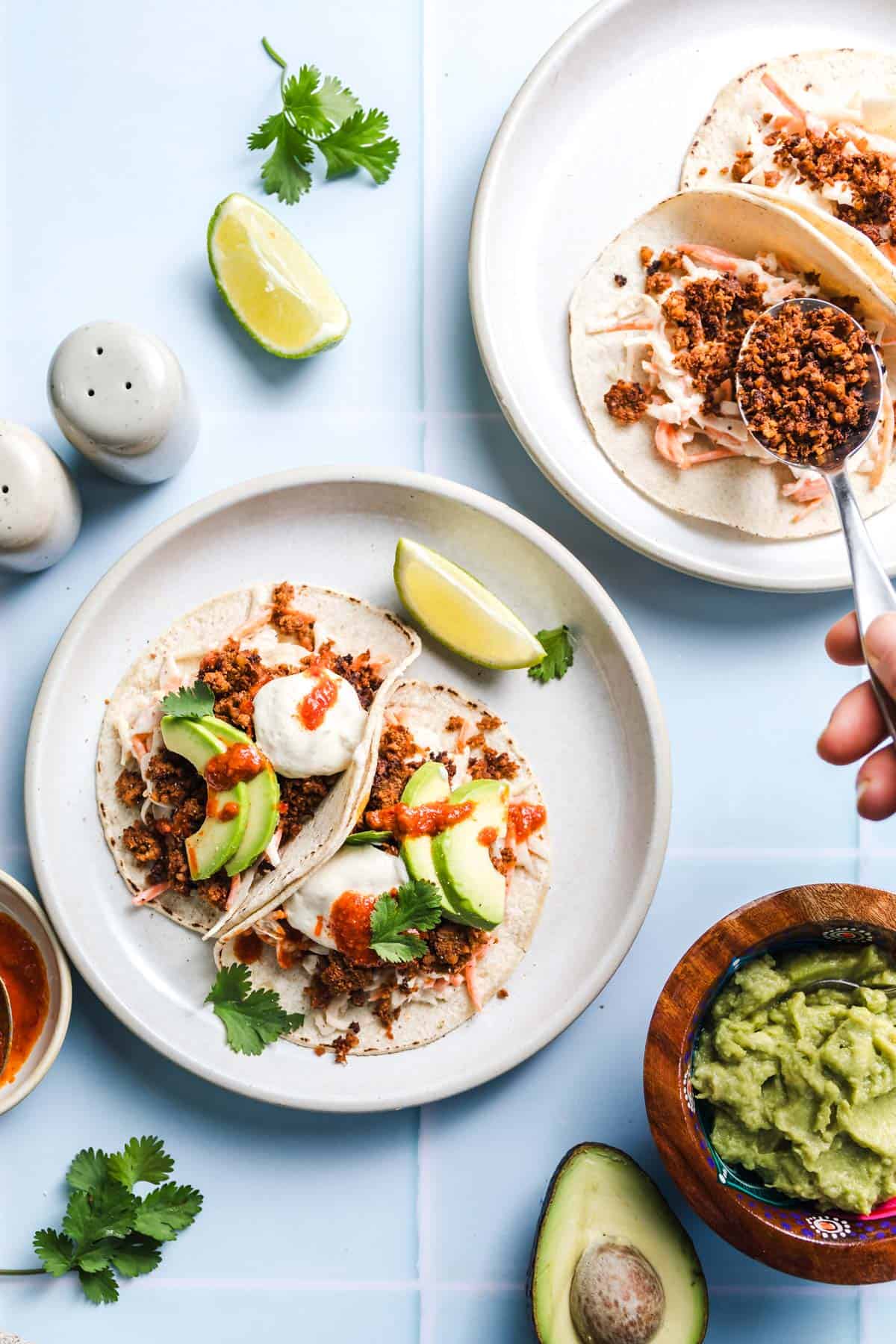 Homemade vegan tacos with avocado, cauliflower walnut meat, and fresh toppings