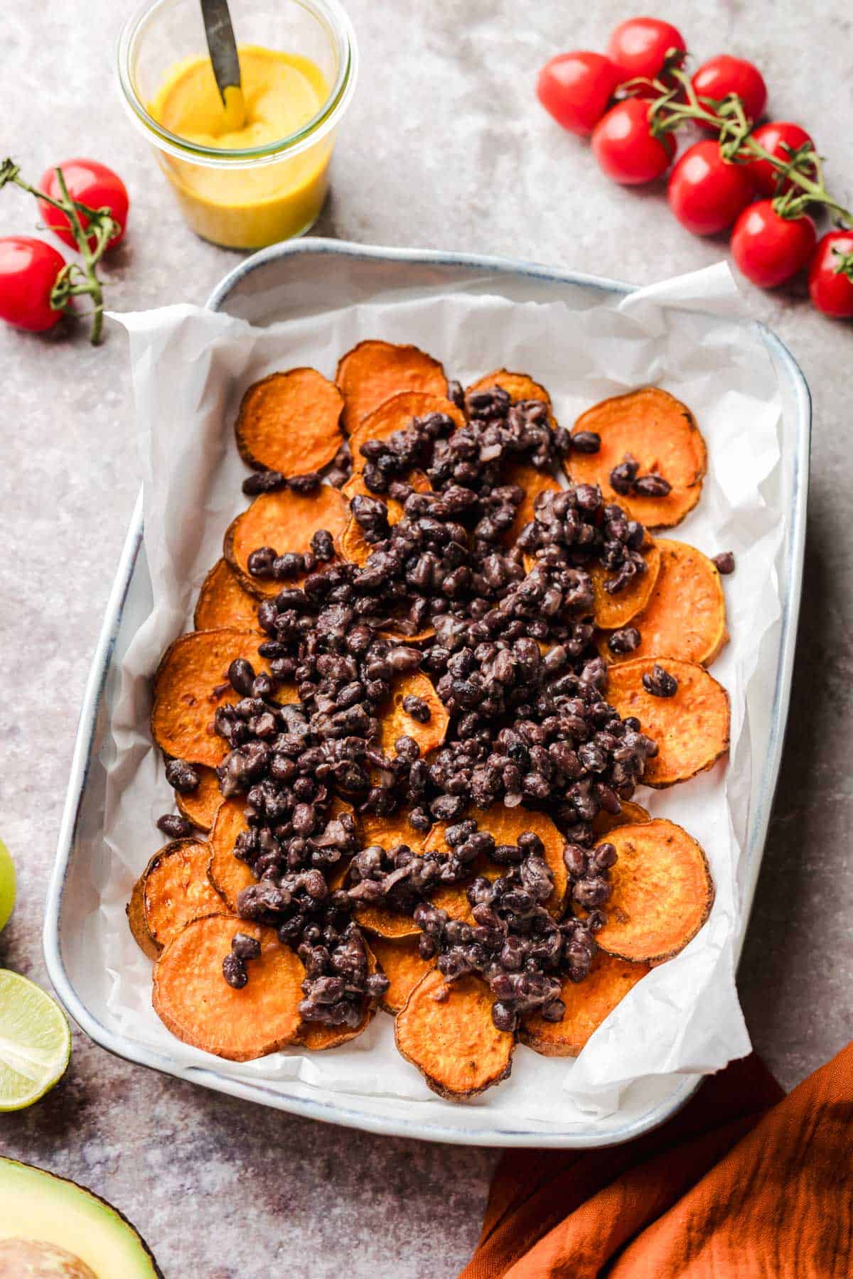 Black beans spooned over crispy baked sweet potato rounds