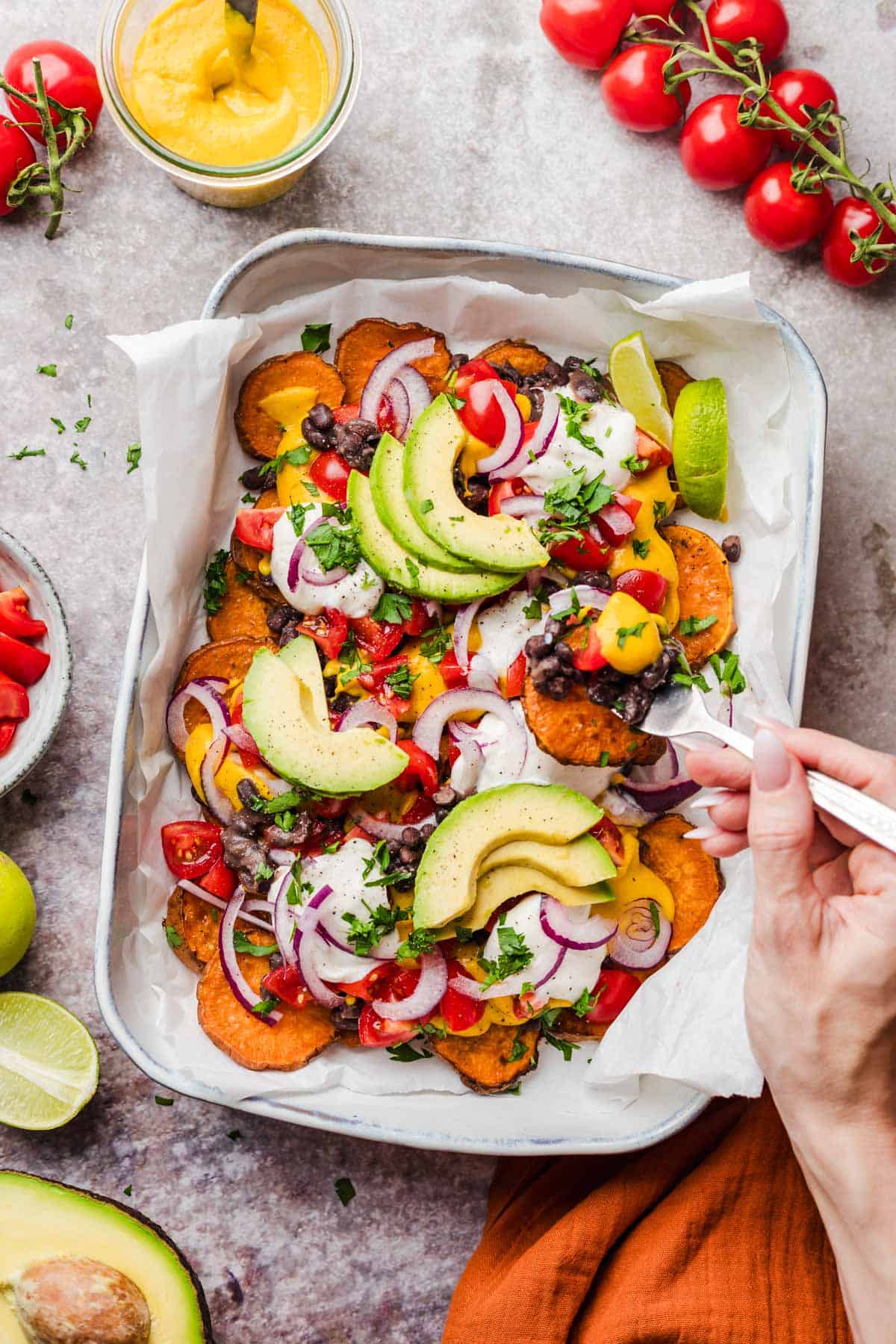 Loaded vegan sweet potato nachos ready to serve with all the toppings