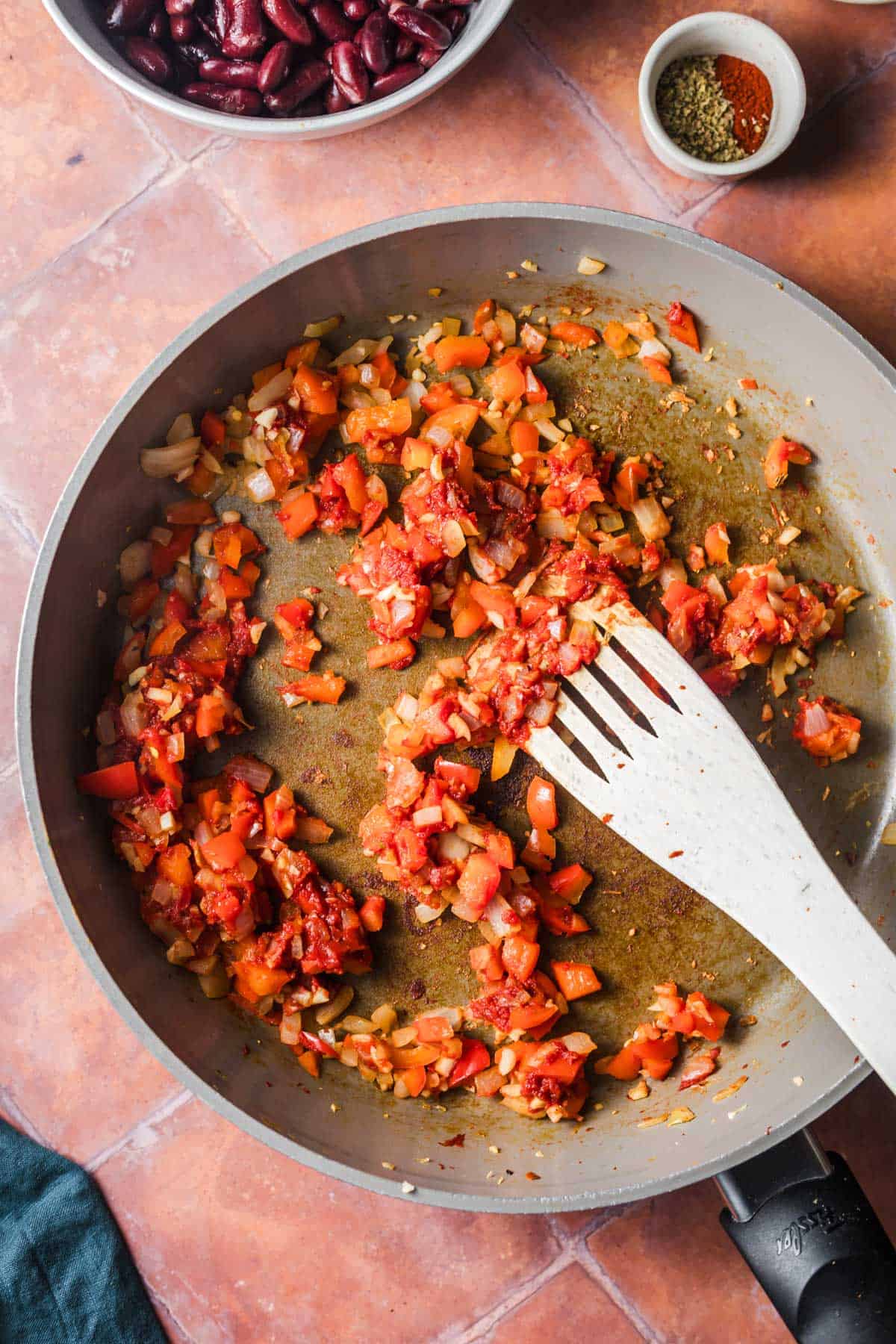 Sauteed onions with tomato paste in a large pan