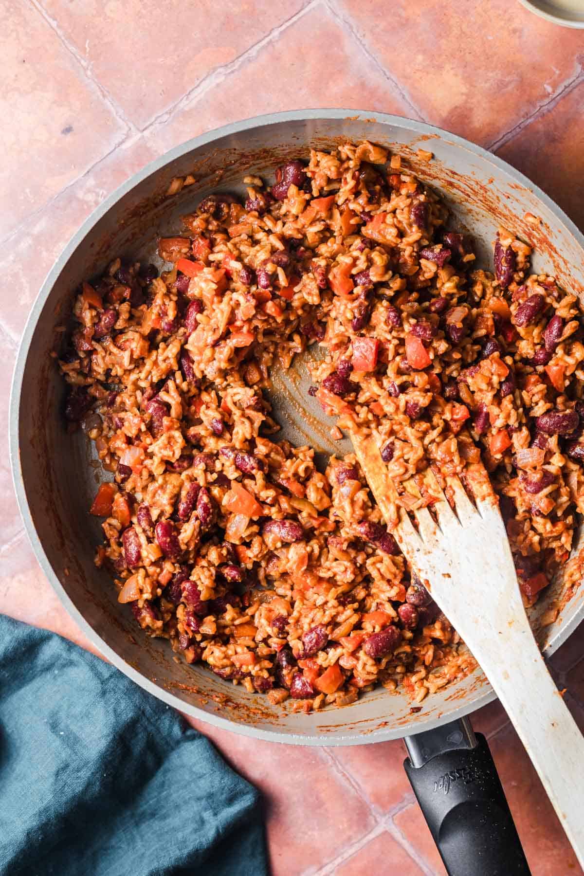 Finished rice and kidney bean filling for stuffed peppers in a pan