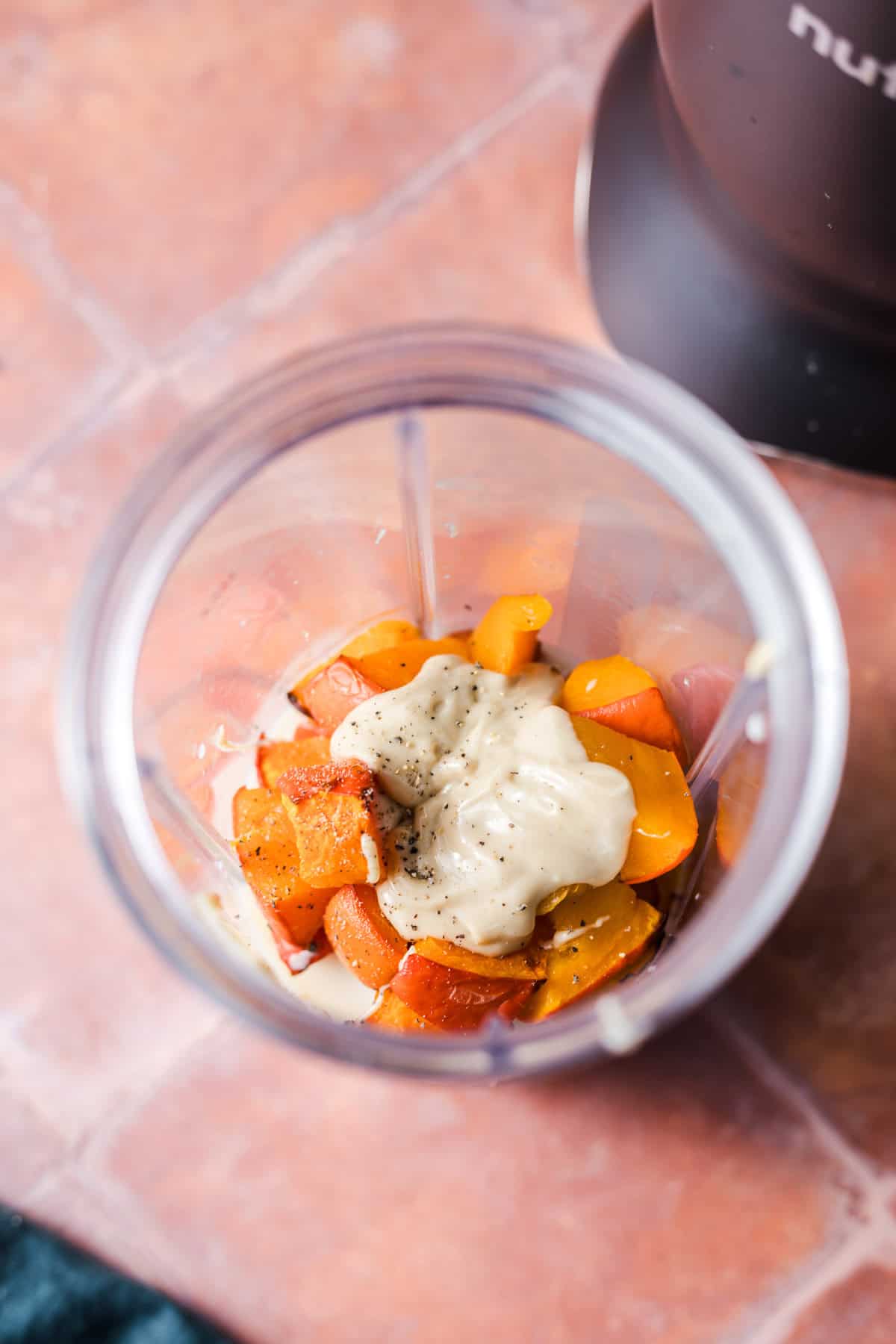 Ingredients for savoury pumpkin cream in a blender